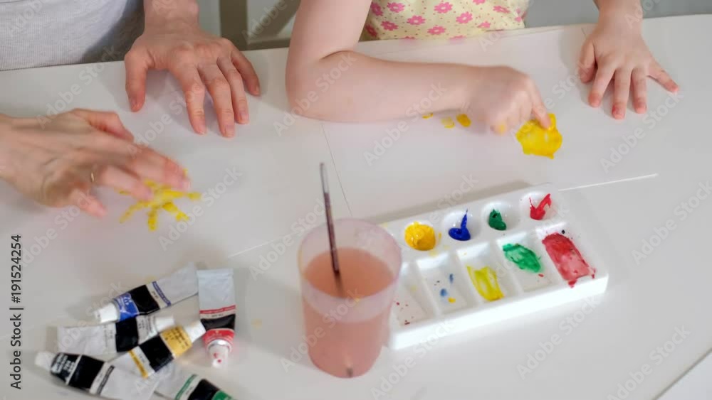 happy family mother and child girl paint paints at home happy family mother and child girl paint paints at home