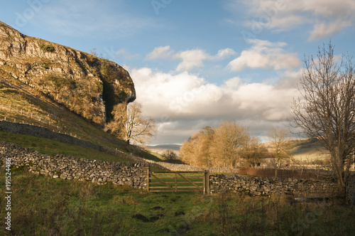 Kilnsey Crag / The 40 ft overhang of the 180 ft Kilnsey Crag in Upper Wharfedale, Yorkshire Dales village of Kilnsey, England. 24 November 2017 photo