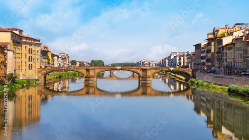 Famous landmark of Florence is the Bridge Trinity. Stone Bridge spanning the river Arno. The oldest elliptic arch bridge in the world. Italy, June 2017. Ponte Santa Trinita.