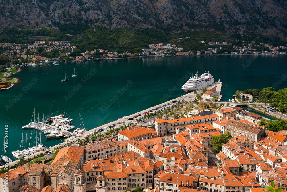 Aerial view of Kotor bay with cruise ship and Kotor Old Town as seen from Kotor Castle Of San Giovanni in Kotor, Montenegro.