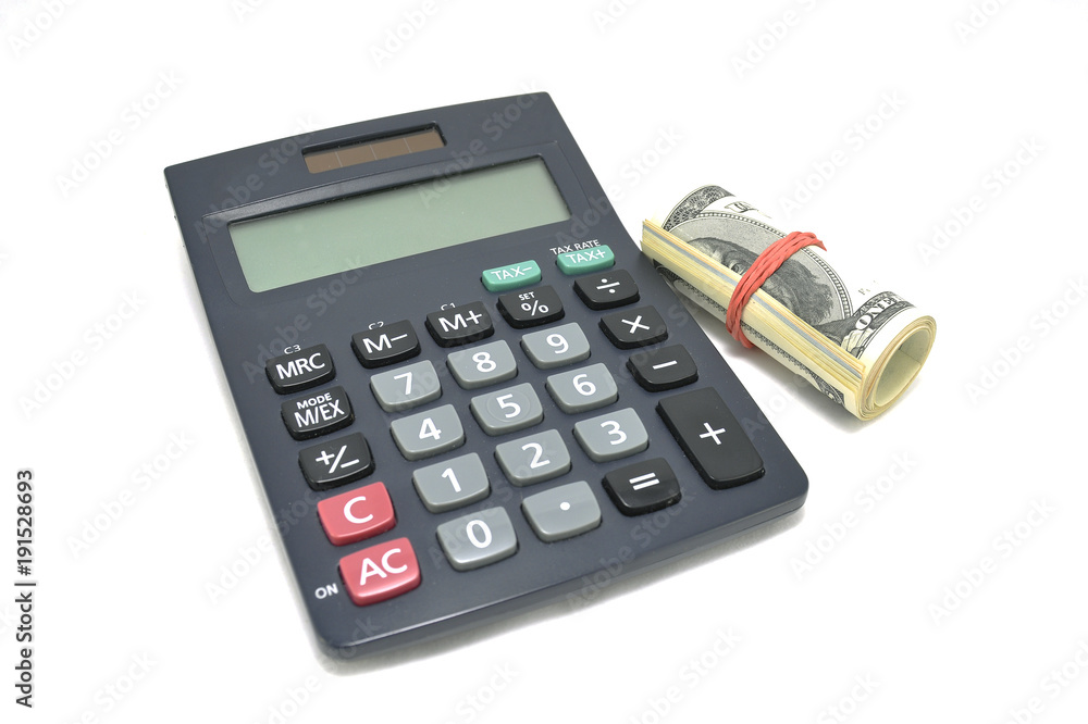 Money and calculator on white background closeup Money and calculator on white background closeup