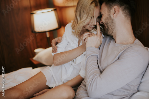 Loving couple on the bed