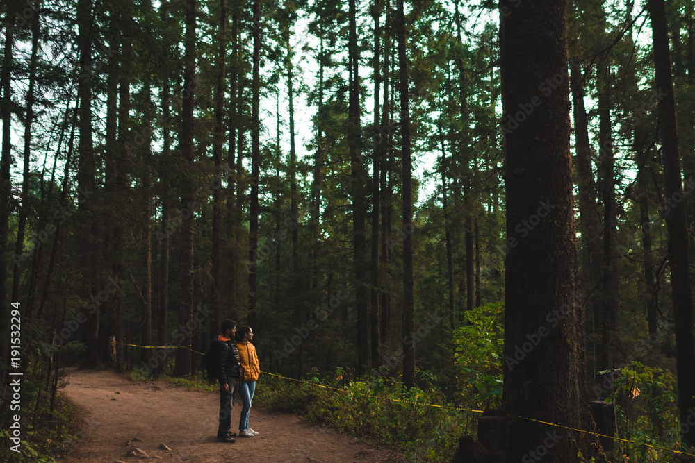 Fototapeta premium couple hiking at forest