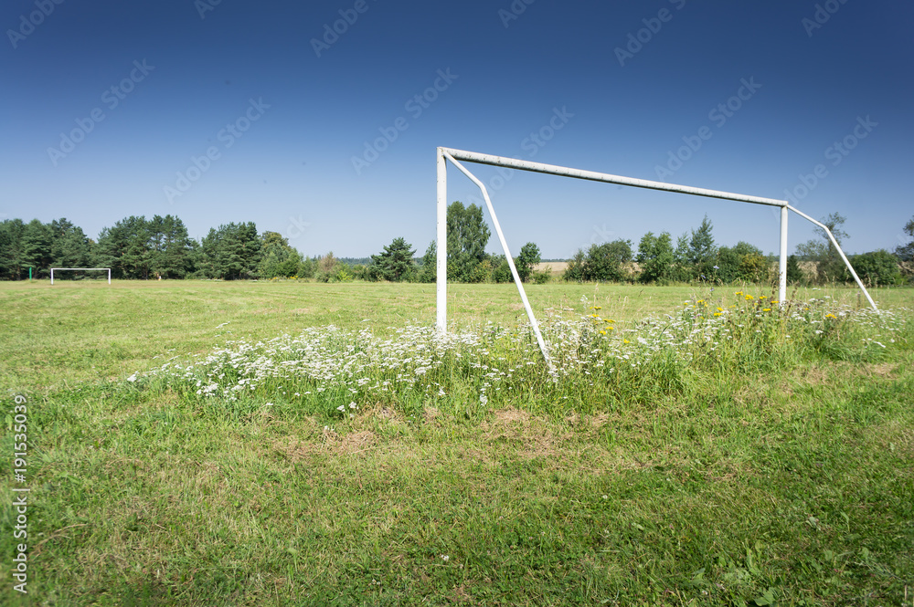 Soccer field with blue sky in the countryside. Soccer field with blue sky in the countryside.