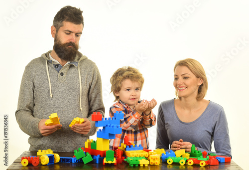Kindergarten and family concept. Man with beard, woman and boy