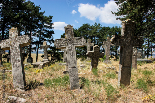 old stone crosses on the ancient cemetery