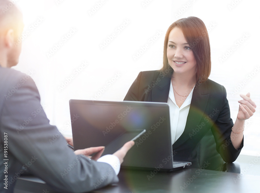 Business people working together at the desk in the office Business people working together at the desk in the office
