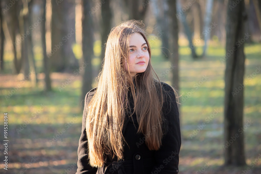 young pretty girl in the spring forest young pretty girl in the spring forest