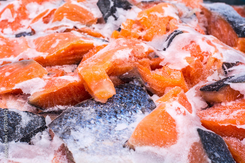 Slices of salmon frozen on ice