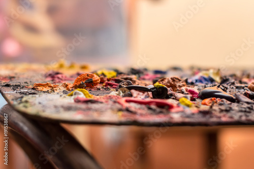  Painter's palette with various colored paints © Monika