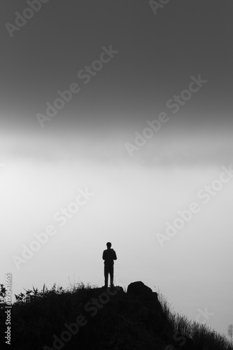 Fototapeta Naklejka Na Ścianę i Meble -  stand alone on top of mountain