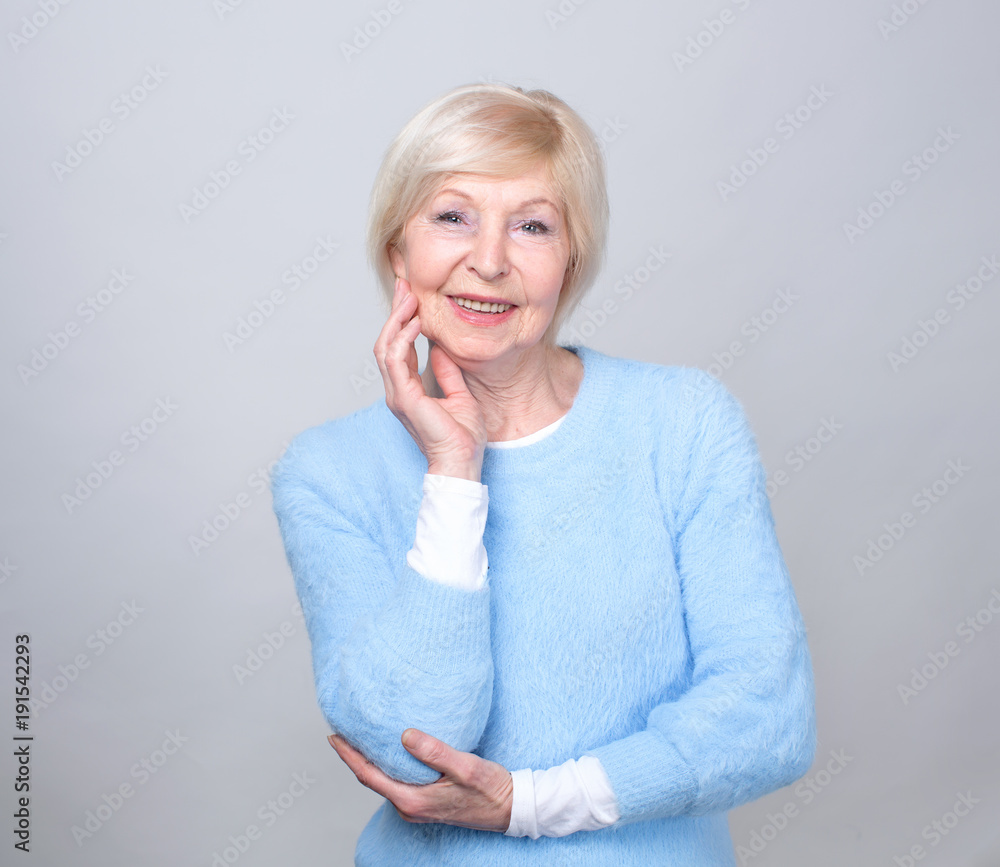 Portrait of a smiling senior woman. Beautiful modern grandmother. She is pensioner. Portrait of a smiling senior woman. Beautiful modern grandmother. She is pensioner.