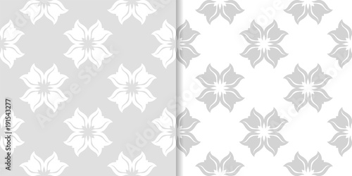 Light gray floral backgrounds. Set of seamless patterns