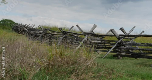 Civil War Time Split Rail Fence with Grass Field Slow Pan Wide, 4K
