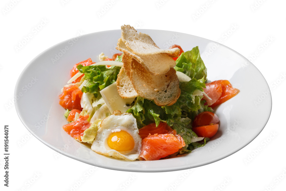 Salad Caesar with salmon on plate isolated Salad Caesar with salmon on plate isolated