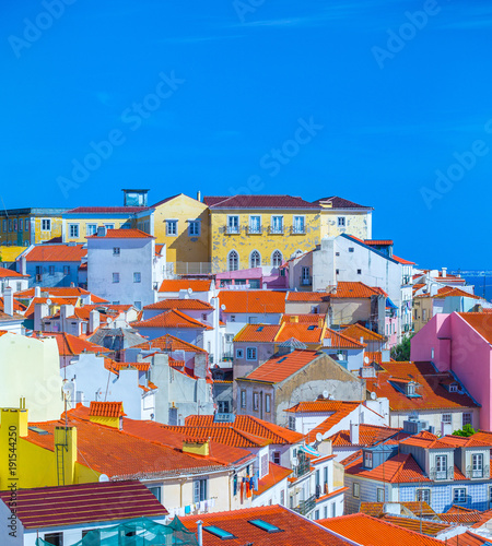 Summertime sunshine day cityscape in the Alfama - historic old district Alfama in Lisbon, Portugal.