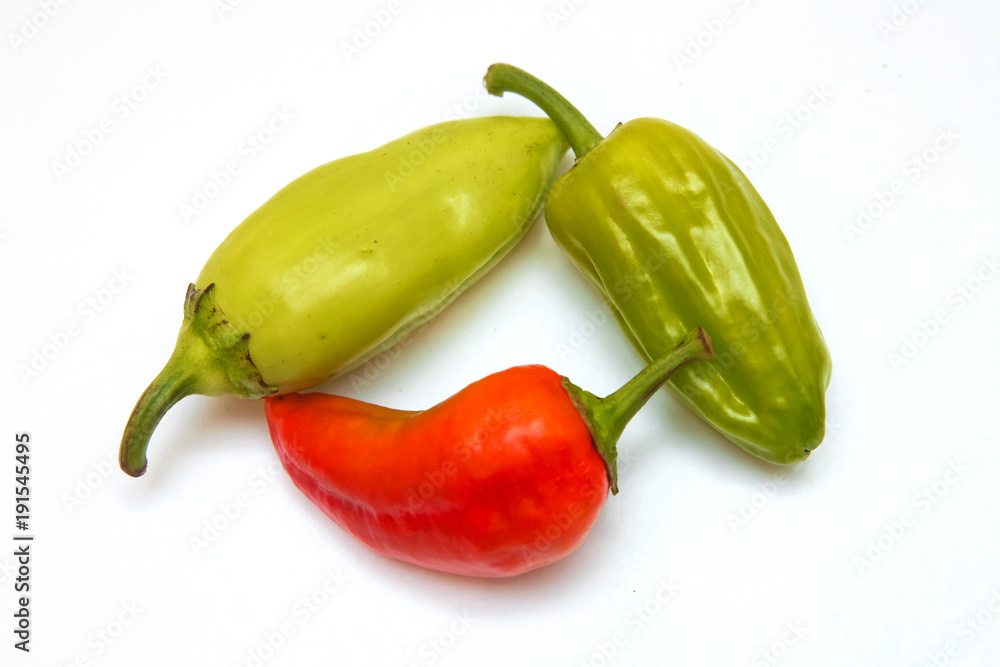 A green chili jalapeno on white background . Single jalapeno pepper isolated on white background . red chili or chilli cayenne pepper isolated on white background cutout A green chili jalapeno on white background . Single jalapeno pepper isolated on white background . red chili or chilli cayenne pepper isolated on white background cutout