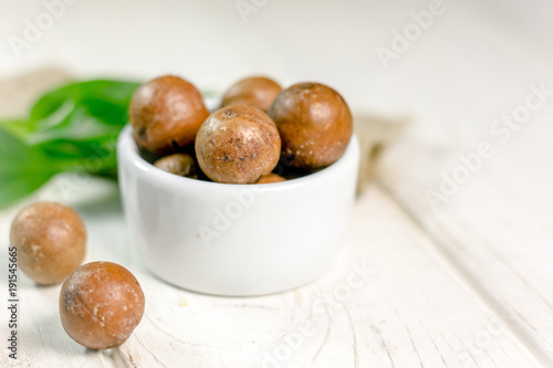 Nice macadamia nuts on whit...