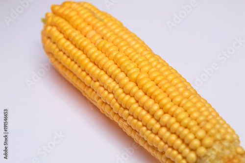 Corn on a white background, isolated . Sweet corn is delicious and ready to eat. Vegetables are beneficial to the body, have vitamins and delicious taste. on white background