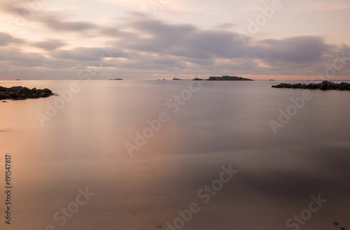A violet sunrise on the beach of Ses figueretes, Ibiza © vicenfoto