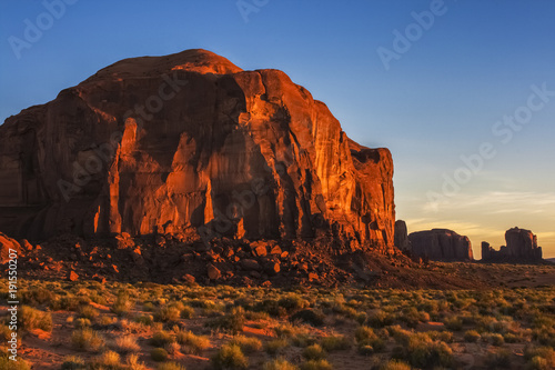 Sunlit rocky formation in early morning in Monument Valley Navajo Tribal Park, Arizona. © Matthieu