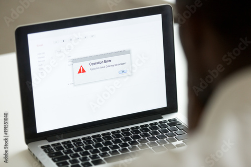 Photography Computer error failure concept, african man using laptop with application failur