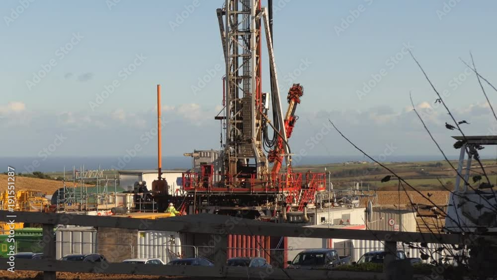 Drilling rig working at mining site on a sunny day near Whitby, North Yorkshire, England. North sea seen in the background Drilling rig working at mining site on a sunny day near Whitby, North Yorkshire, England. North sea seen in the background