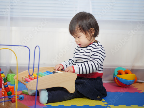 baby girl play toy at home