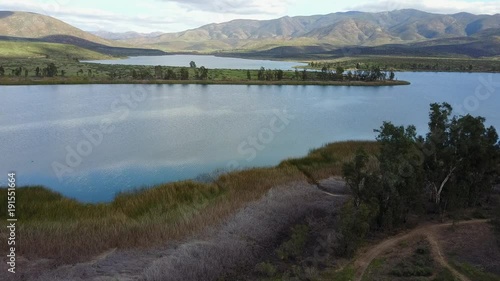 San Diego, CA Lower Otay Lake Reservoir  - Drone Video. Aerial Video of Lower Otay Lake is an artificial lake in San Diego County, California, flanked by Otay County Open Space Preserve. photo