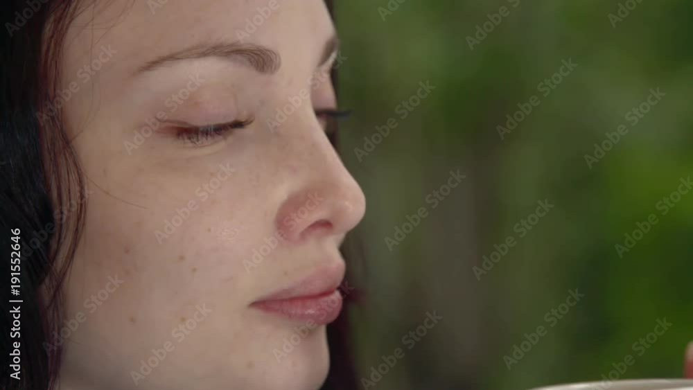 Girl with a coffee close-up