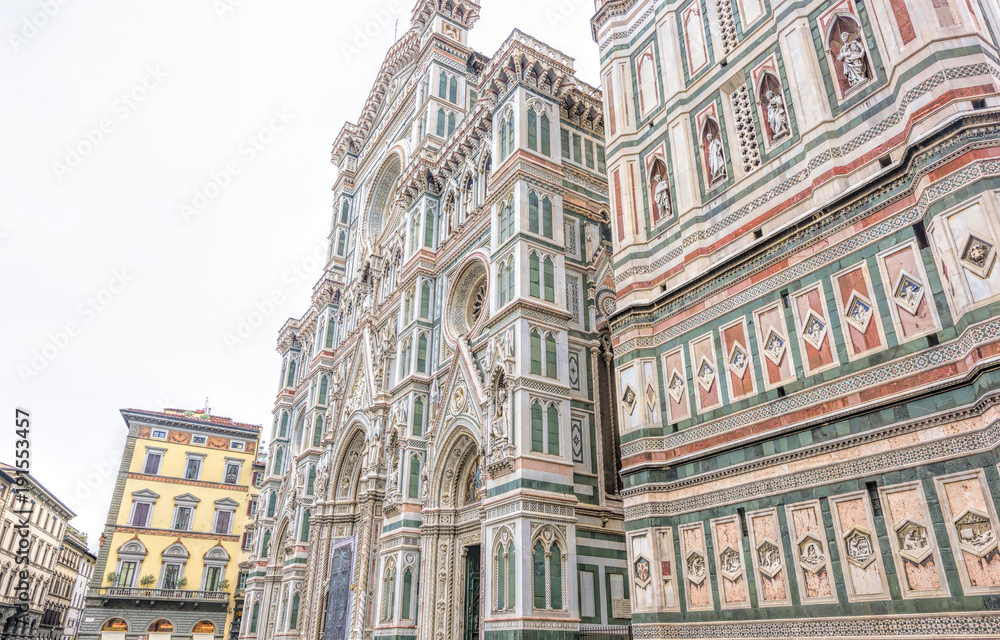 Obraz premium Daylight cloudy day view from bottom to ornamented facade of Cathedral Saint Mary