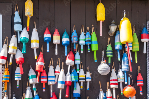 Outside Wall Decorated with Fishing Buoys photo