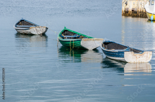 Obraz na plátně Trio of Row Boats Lined up for Fishing