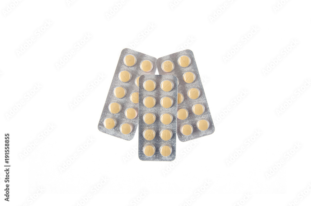 three plates of yellow pills on white isolated background three plates of yellow pills on white isolated background