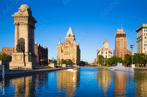 Downtown Syracuse New York with view of historic buildings and fountain at Clinton Square photo