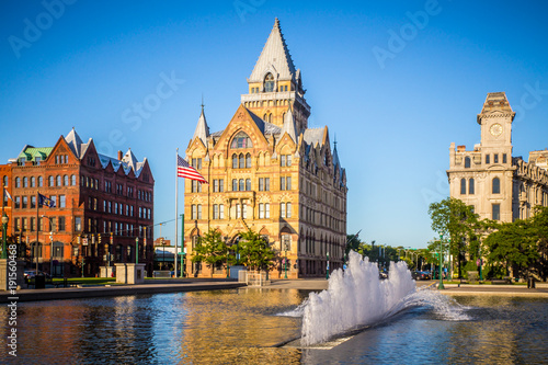 Downtown Syracuse New York with view of historic buildings and fountain at Clinton Square photo