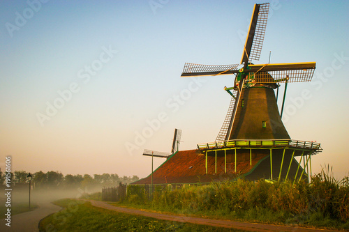 Early sunrise on Dutch landscape and windmill at the Zaanse Schans