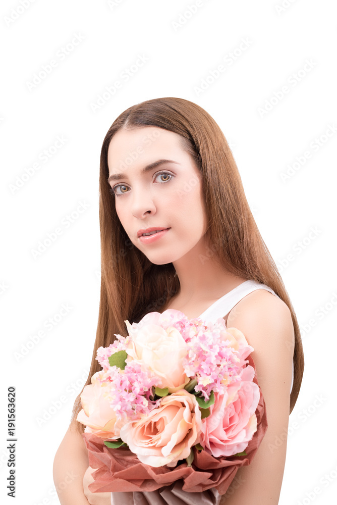 Portrait of young beautiful caucasian woman holding a bouquet of flowers in her hands isolated on white background . Looking at camera Portrait of young beautiful caucasian woman holding a bouquet of flowers in her hands isolated on white background . Looking at camera