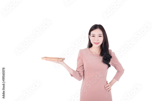Portrait of happy young asian beautiful casual woman presenting open hand palm with copy space for your product and text isolated on white background