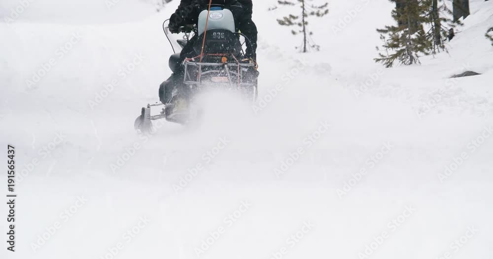 Snowmobile climbing ski slope in Colorado Snowmobile climbing ski slope in Colorado