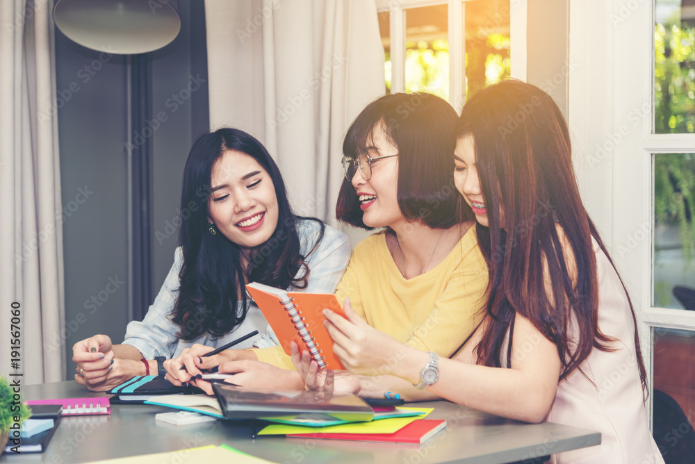 Group of friends teenagers sitting and discussing in meeting room ,indoors .Students friends happiness and brainstorm together concept Group of friends teenagers sitting and discussing in meeting room ,indoors .Students friends happiness and brainstorm together concept