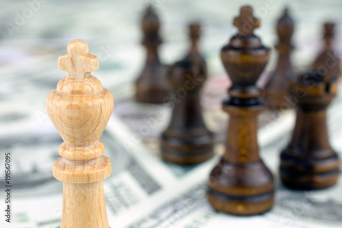 chess figures dollar bills crisis intervention concept