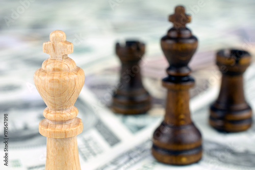 chess figures dollar bills crisis intervention concept