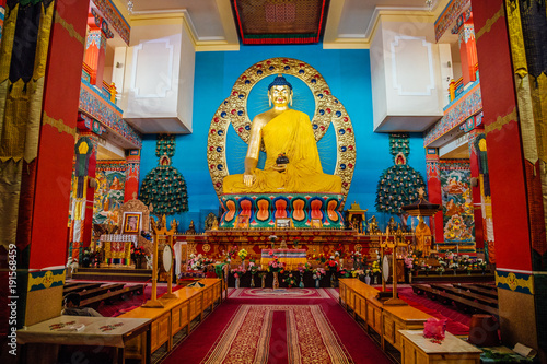 ELISTA, KALMYKIA, RUSSIA - APRIL 24, 2017: Buddhist temple interior. Statue of seated Buddha in the Temple Golden Abode of Buddha Shakyamuni  © Mulderphoto