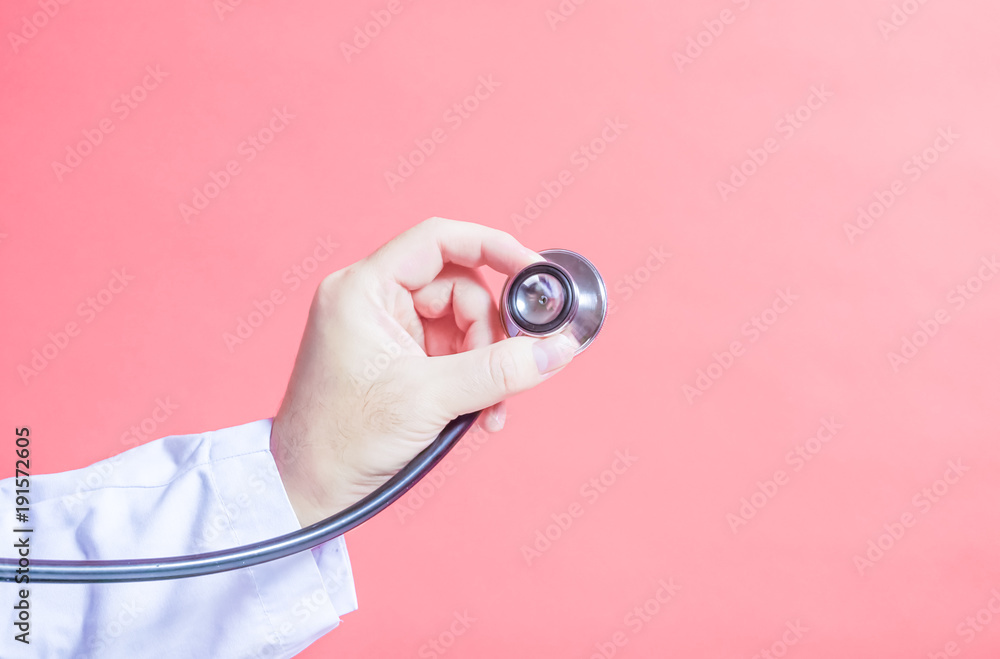 A doctor and stethoscope 聴診器を当てる手 診察、健康診断、病院、病気などのイメージ パステルカラーのパターンピンク色背景  Stock Photo | Adobe Stock