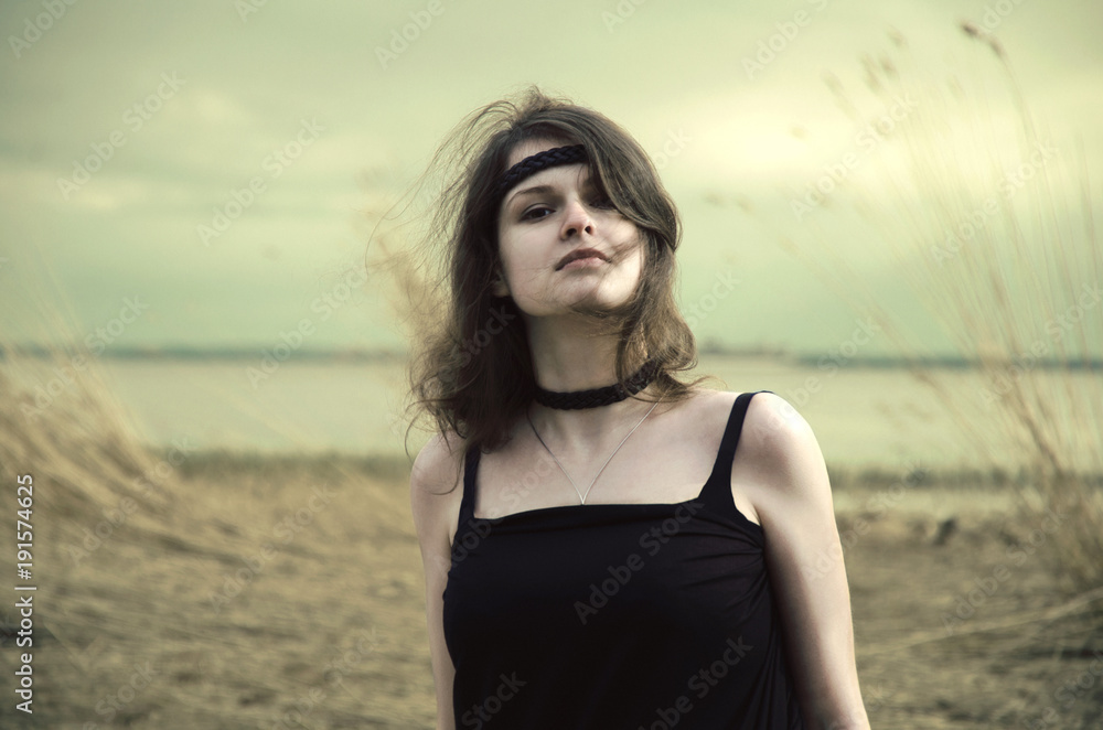 portrait of a young woman walking in the autumn swamp portrait of a young woman walking in the autumn swamp