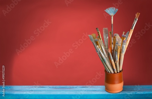 Brushes in a glass jar
