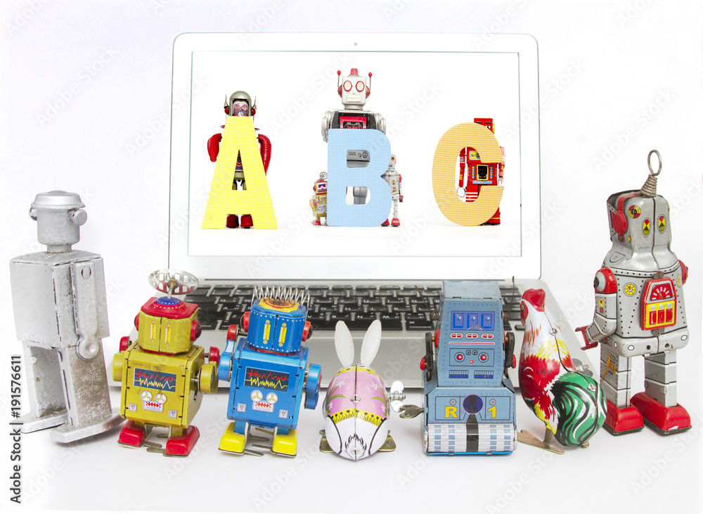 robots teching robots ABC  on a laptop