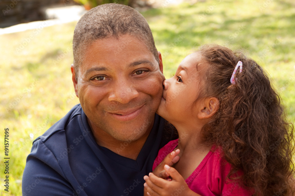 African American father and his daughter. African American father and his daughter.
