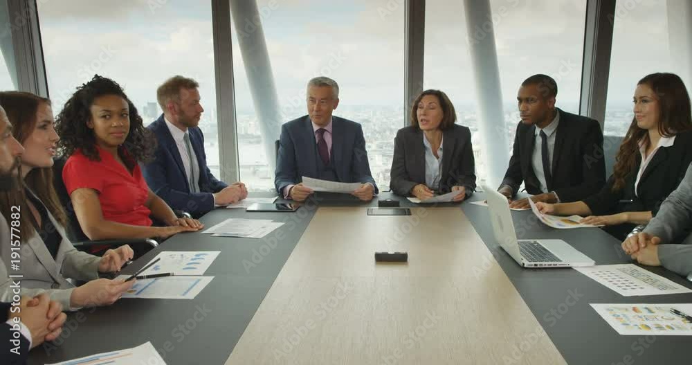 4K Cheerful financial business team in boardroom meeting discussing ideas & offering opinions 4K Cheerful financial business team in boardroom meeting discussing ideas & offering opinions